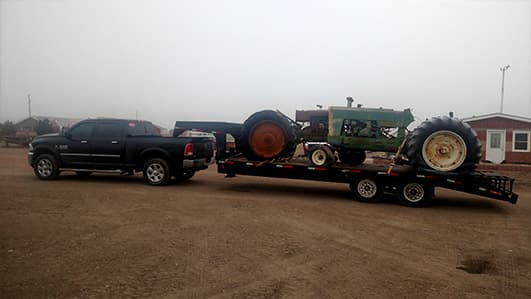 Truck hauling large tractor